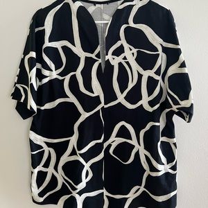 012- Black and White top . Brand new without tags .